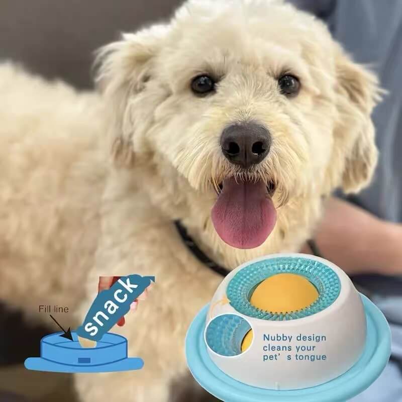 Dog licking peanut butter spread on the interactive slow feeder bowl