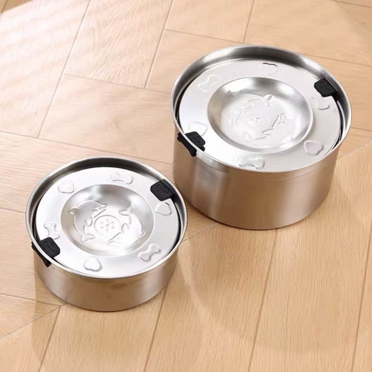 Small and large stainless steel floating water bowls side by side for size comparison