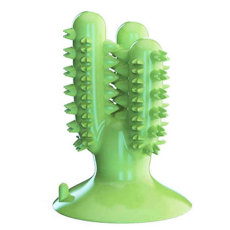 Green dog toothbrush chew toy with raised nubs, a center groove, and a wide suction cup base
